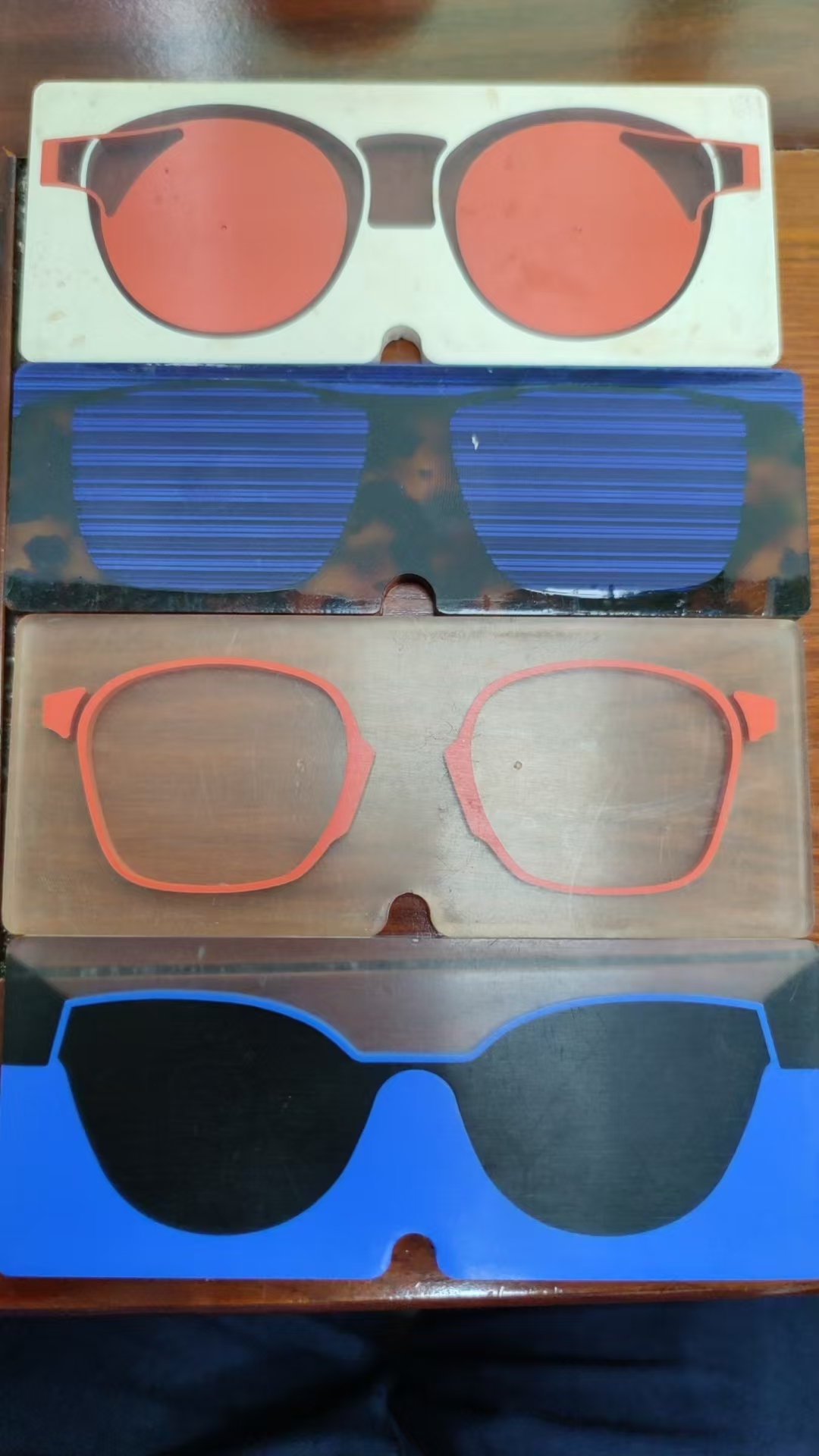 Layered acetate frame-front blanks showing different color constructions