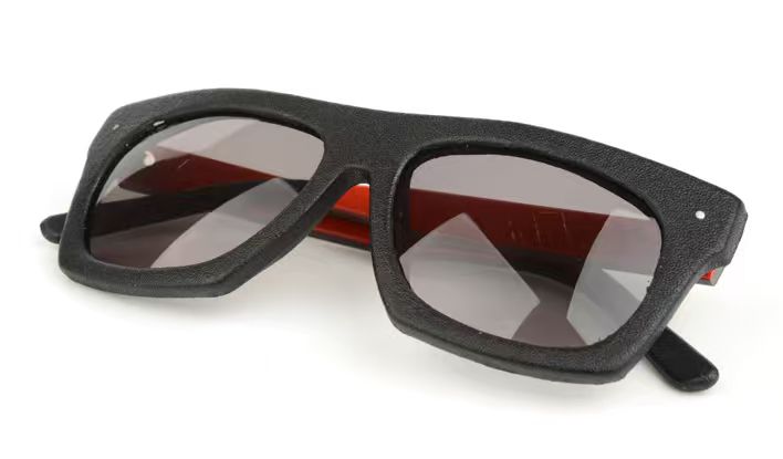 Black eyeglass frame with a fine-grain covered front and temples
