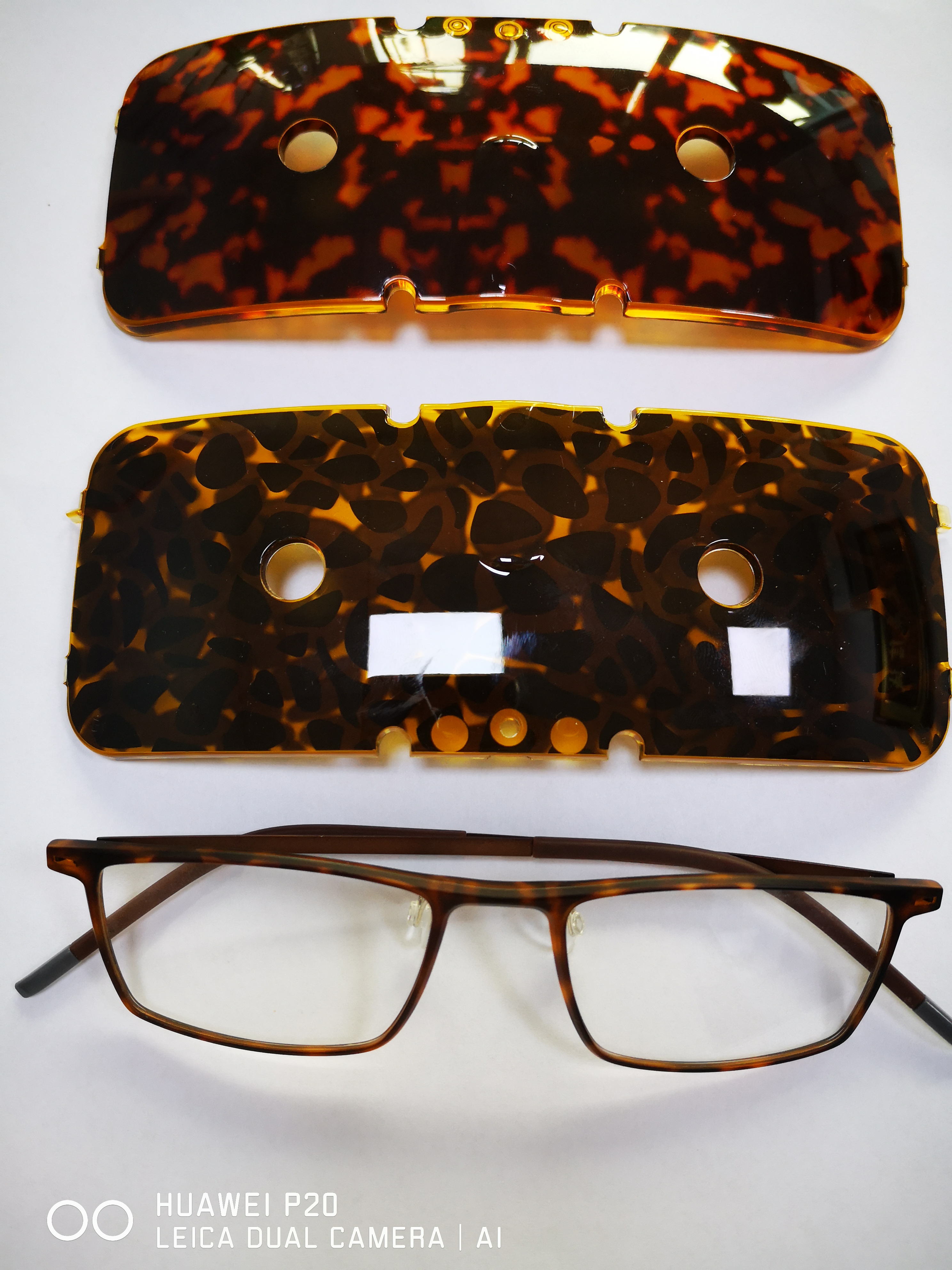 Tortoiseshell patterned TR90 sheets and a finished optical frame made by film-insert molding